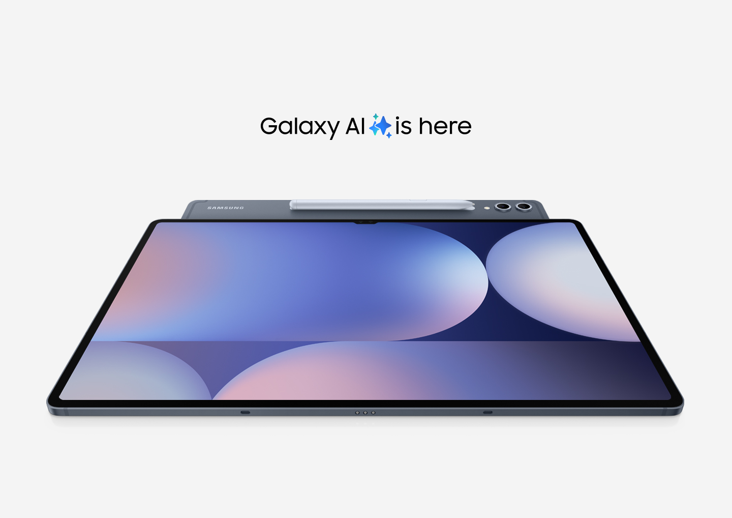 A Galaxy Tab S10 Series device angled to show its rear camera and S Pen, is placed under another Tab S10 device facing up with a colorful wallpaper on display. Text reads Galaxy Tab S10 Series. Galaxy AI is here.