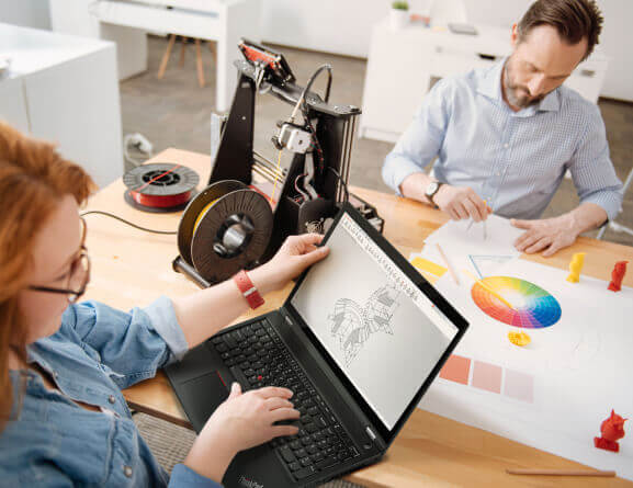 Lenovo ThinkPad P15 laptop open 120 degrees sitting on a table slightly at an angle in front of a young woman
