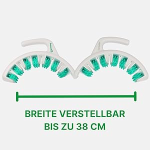 İki kavisli bölüm halinde düzenlenmiş yeşil kıllara sahip ayarlanabilir beyaz plastik cihaz. Metinde genişliğin 38 cm'ye kadar ayarlanabileceği belirtiliyor