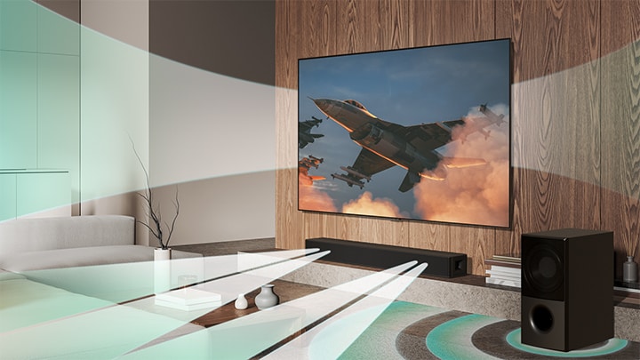 Duvara monte edilmiş LG TV'de bir uçak gösteriliyor ve sanal ses efekti LG TV, LG Soundbar SH5A ve subwoofer’dan eş zamanlı yayılarak WOW Orkestra’yı oluşturuyor.