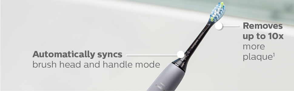 gri diş fırçası sapı üzerinde siyah fırça kafası