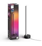 Metinde 'Philips Hue Play Gradyan Işık Şeridi' yazıyor. Ürün ambalajı ve koyu arka plana karşı renkli degrade aydınlatma efektleri gösteren ışık şeridi.