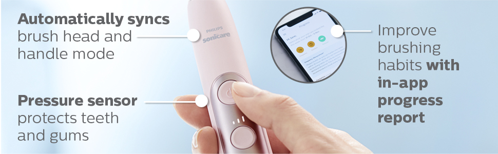 hand holding pink toothbrush handle