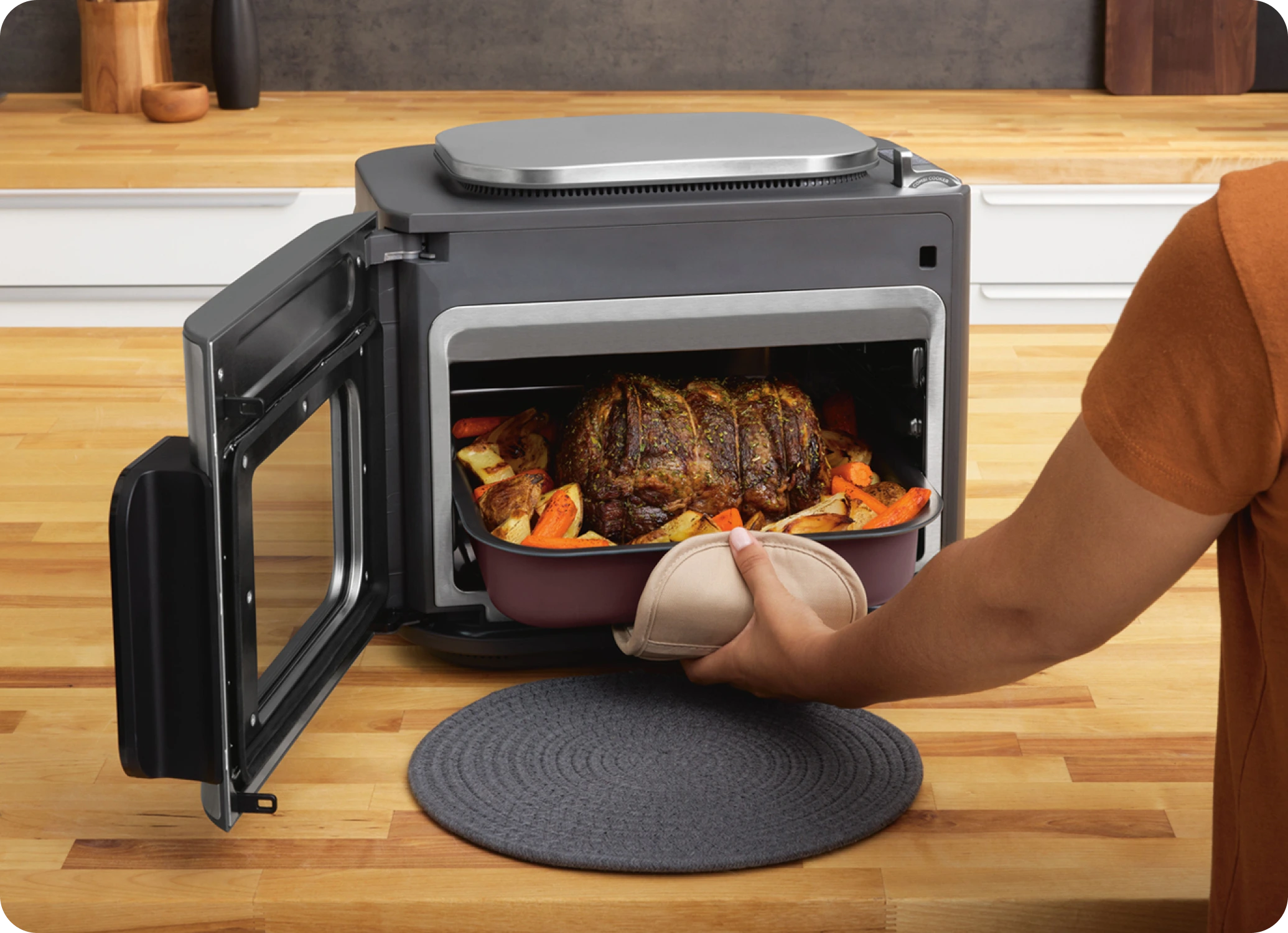 Woman using vacuum in kitchen