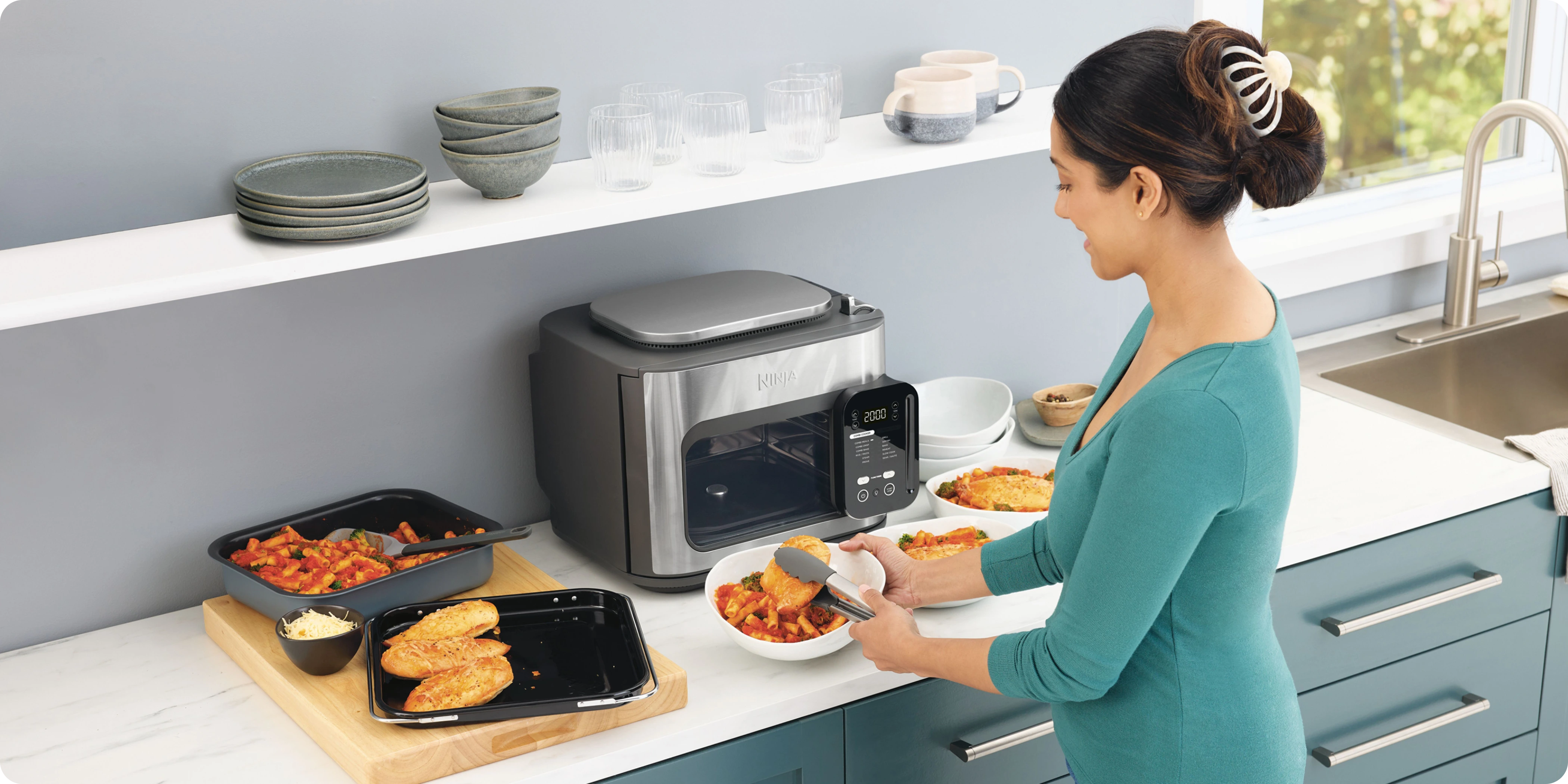Vacuum cleaner being used in a modern living room, with a dog sitting on the carpet